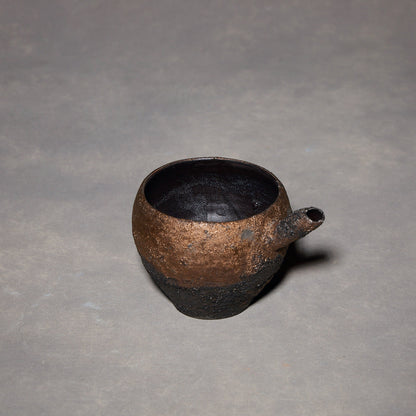 Yuko Ikeda Katakuchi rotondo in bronzo